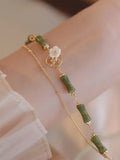 Natural olivine double layer bracelet with twin Bells of Ireland charms and olive branch design elements