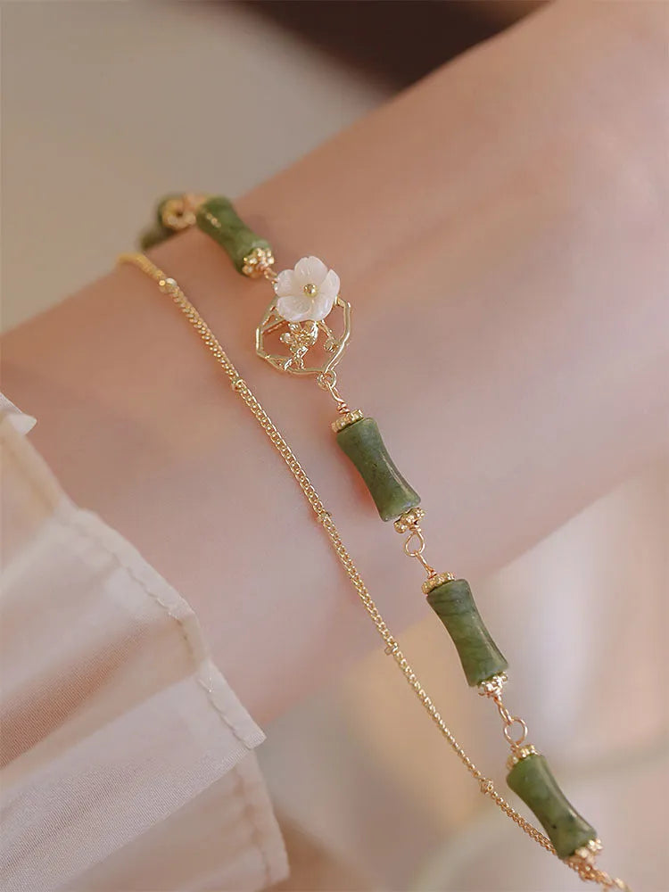 Natural olivine double layer bracelet with twin Bells of Ireland charms and olive branch design elements