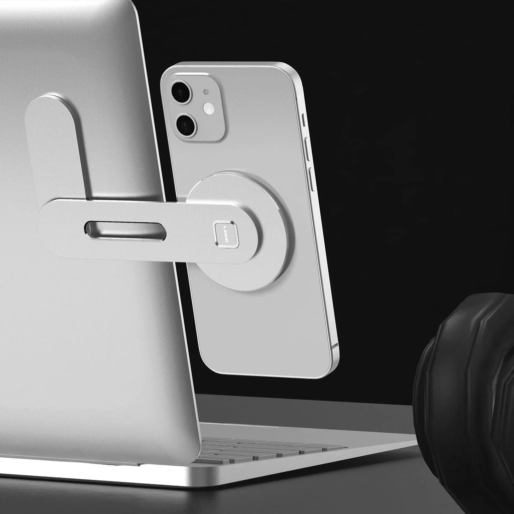 Aluminium magnetic desktop laptop stand in silver colour with silicone pads and arc-shaped magnetic strip.