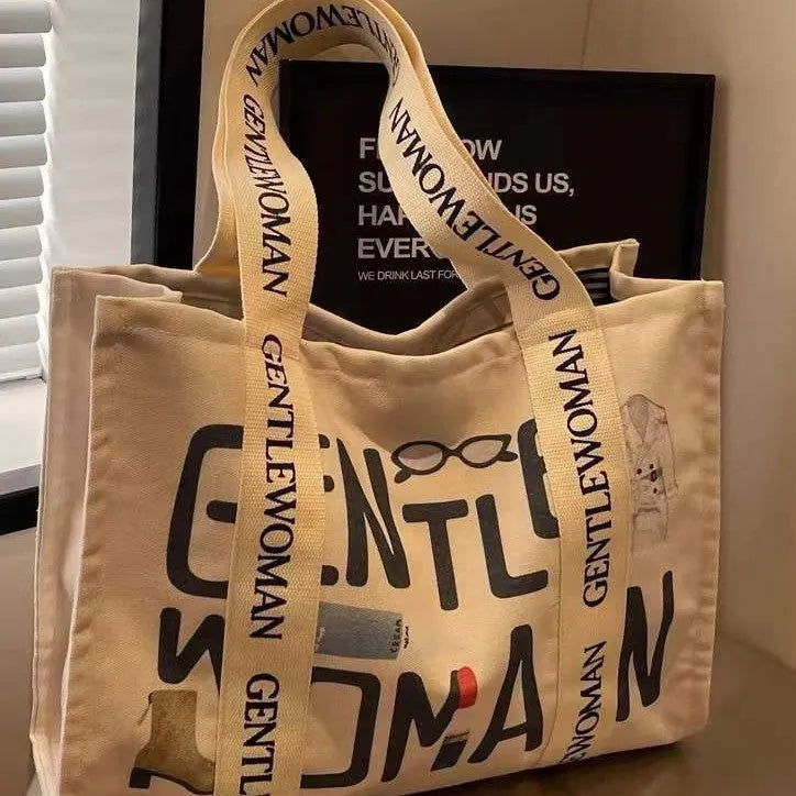 Large capacity canvas tote bag with printed letter design for women's travel and shopping
