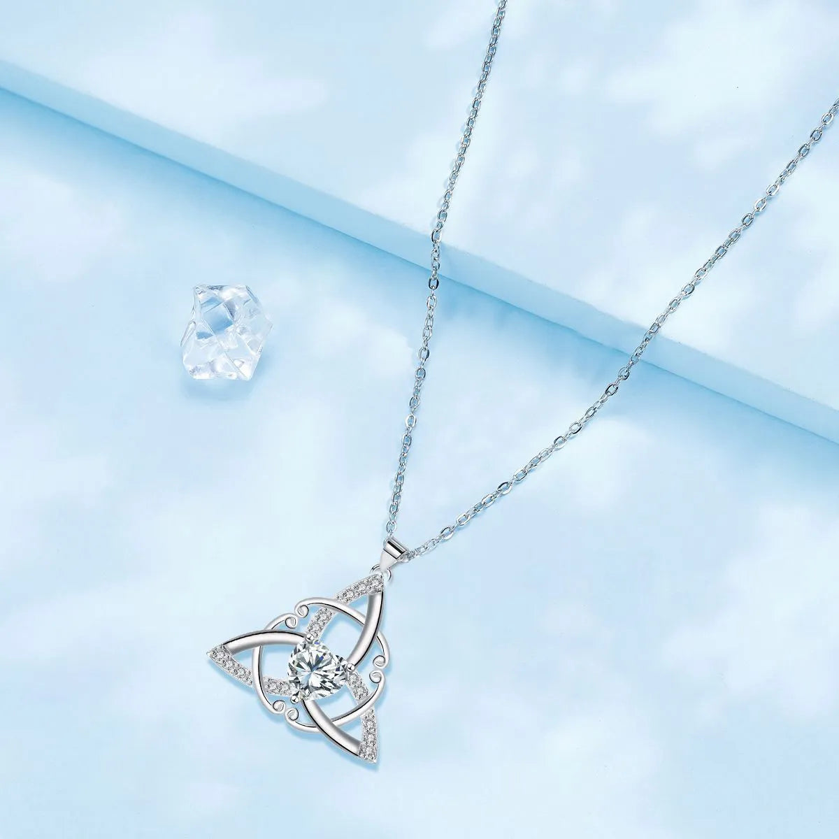 Geometric Celtic knot women's necklace in electroplated copper, shown in one of four colour options.