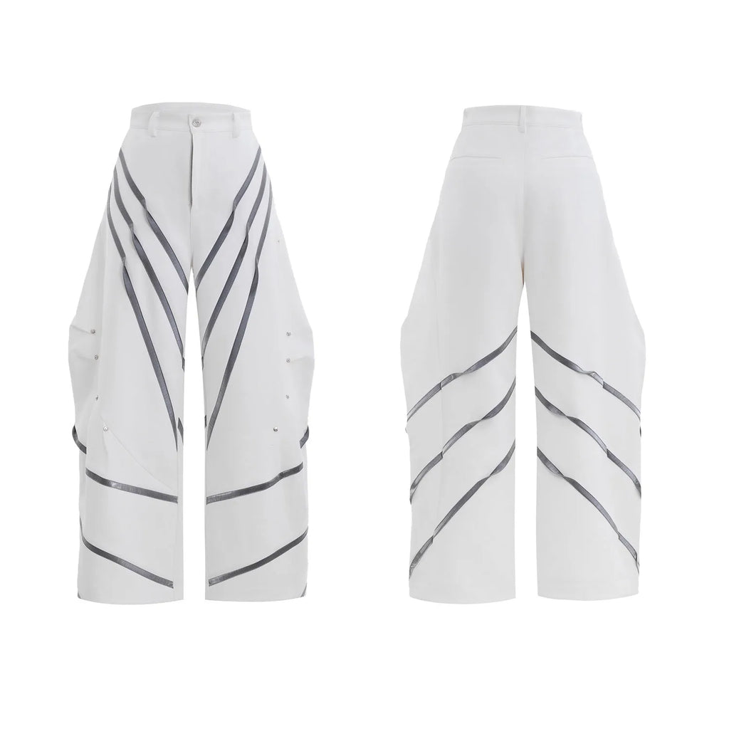 Men's polyester trousers with metal striped rivets and pleated detailing in black or white options