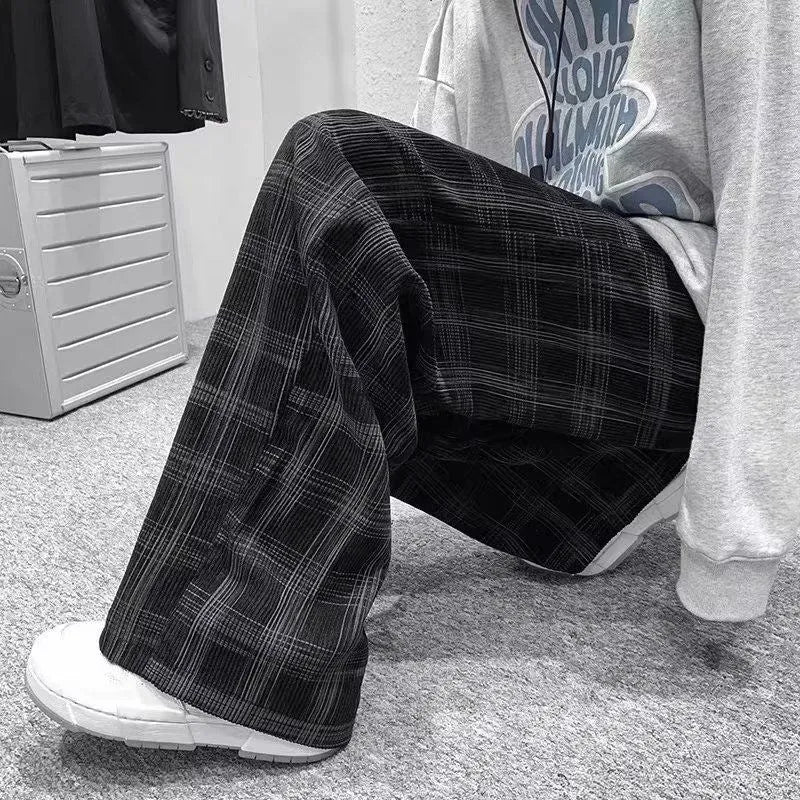 Loose-fit straight-leg plaid trousers in black and green colour options