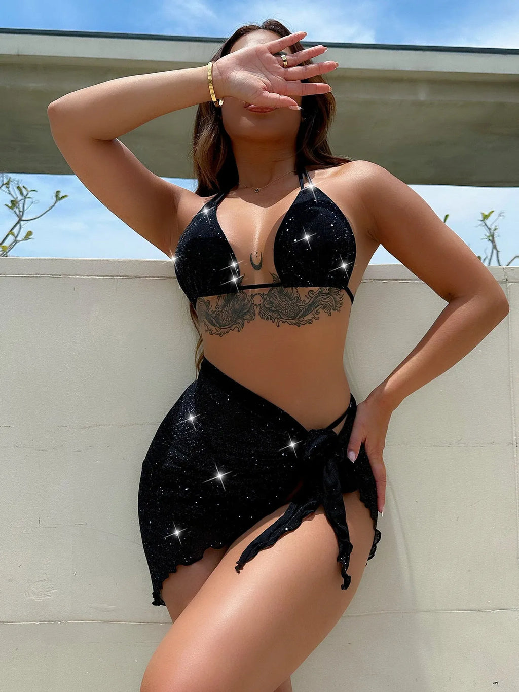 Black three piece bikini set with high waist shorts and top made of polyester fiber