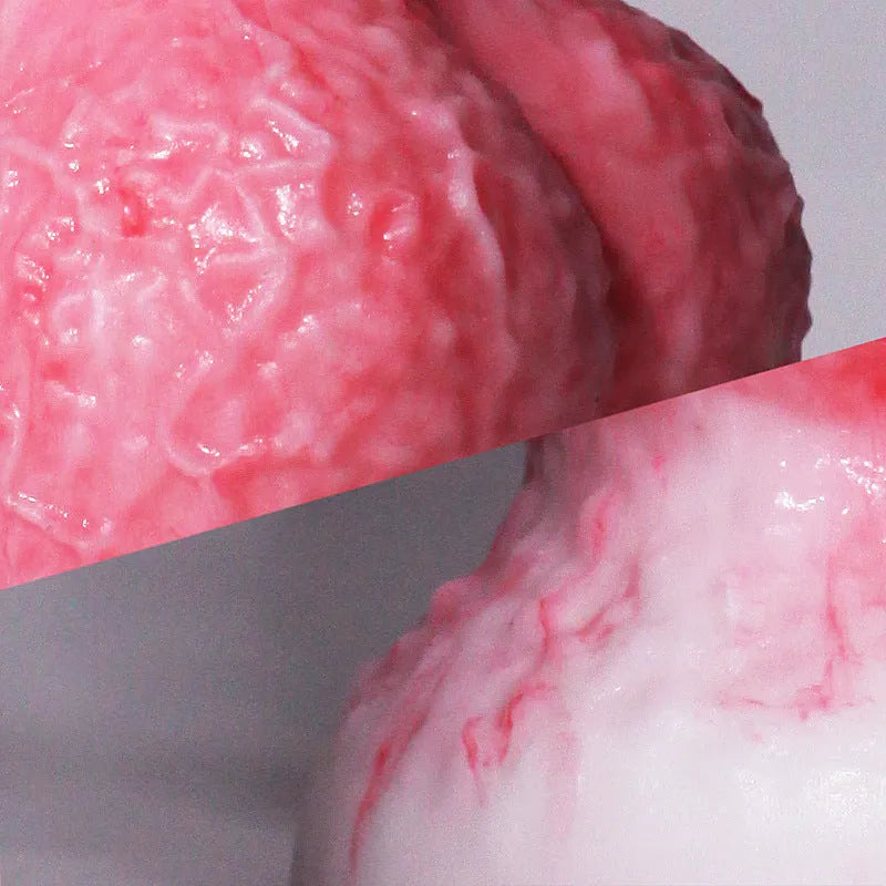 Pink platinum silicone penis-shaped adult toy for women, showing Berserker S and M size options.