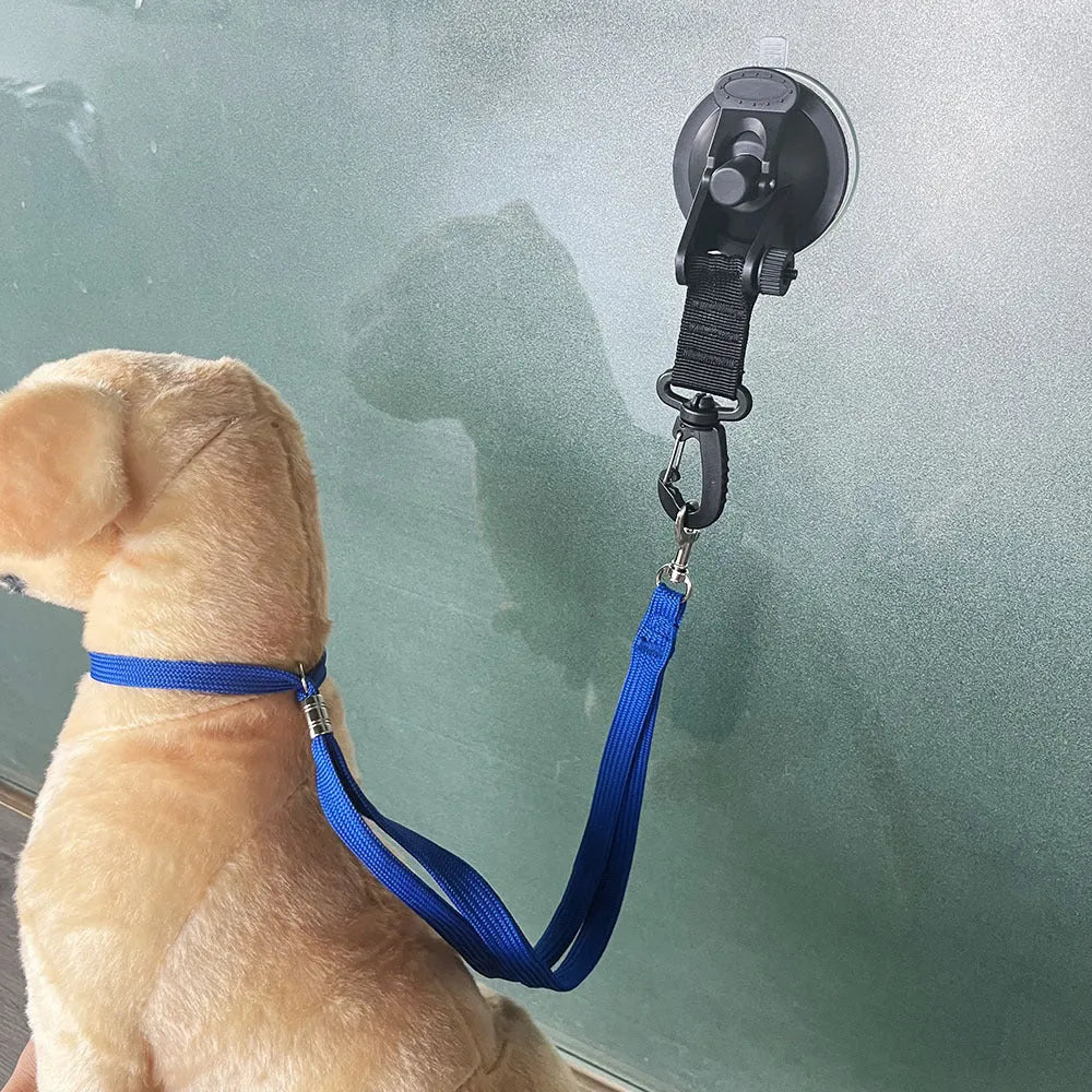 Pet bathing restraint system with suction cups and handcuff-style ties in black and blue colour options