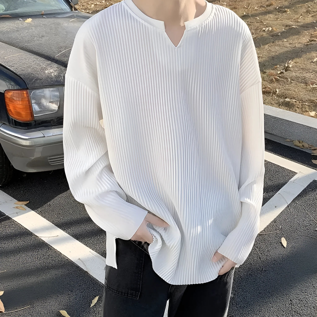 Plus size women's loose grey striped texture long sleeve pullover top on a hanger.