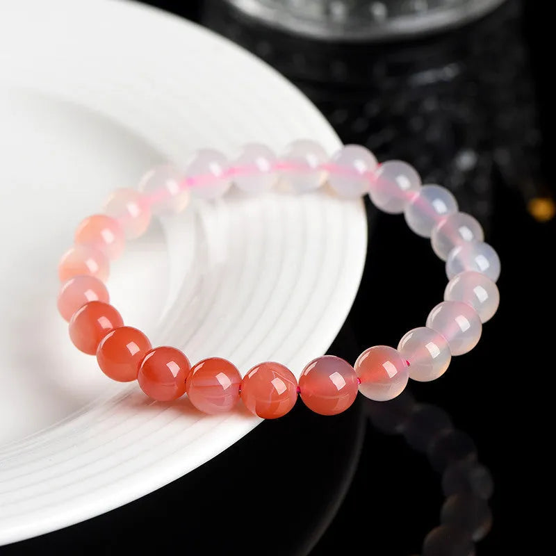 Yanyuan agate bracelet showing gradient salt source colour on wrist, with geometry style beads.