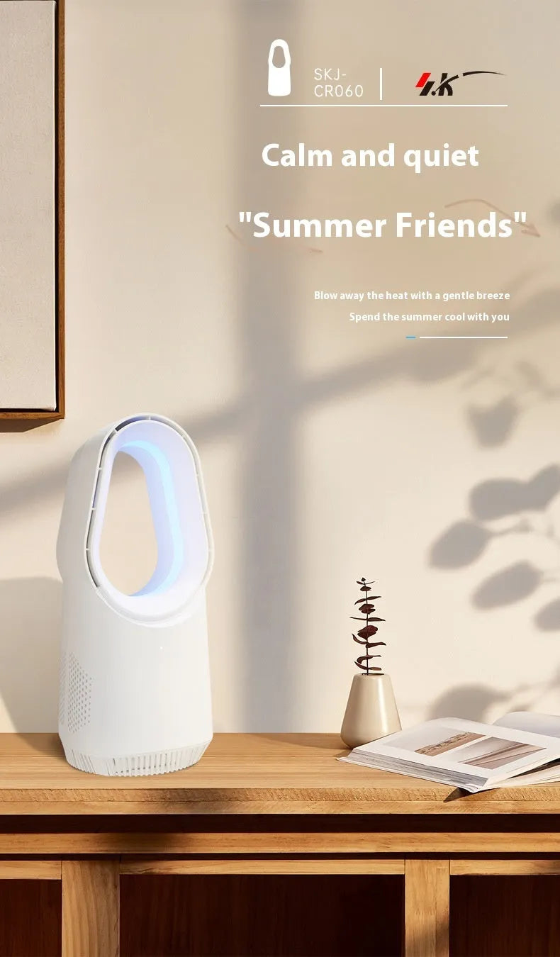 White SK bladeless tower floor fan with remote control on a wooden floor next to a desk.