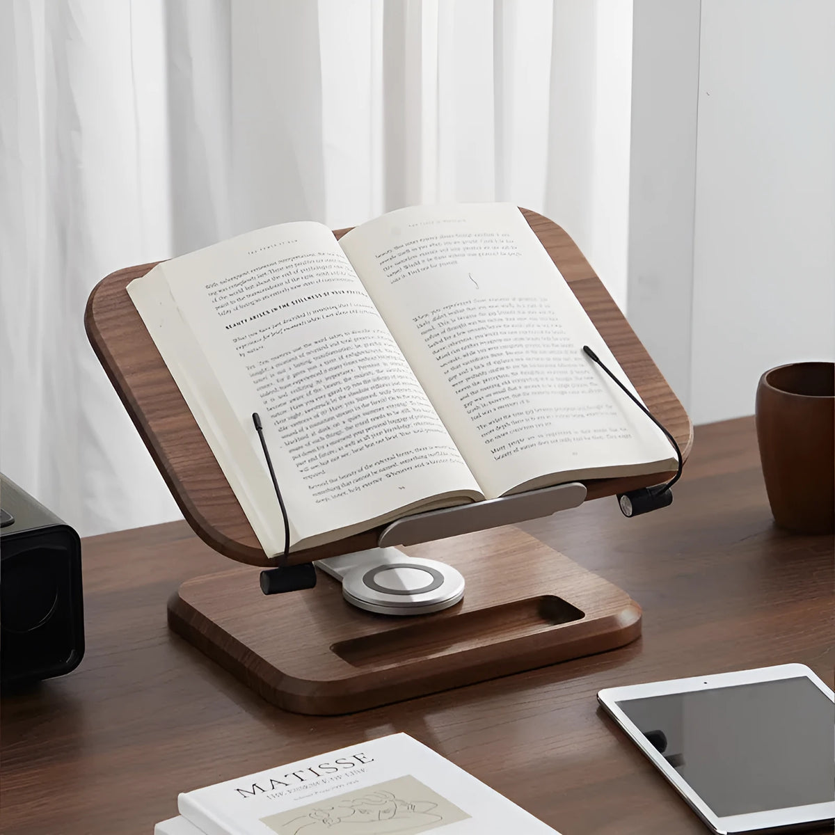 Solid wood adjustable reading rack in walnut colour holding a book at an angle.
