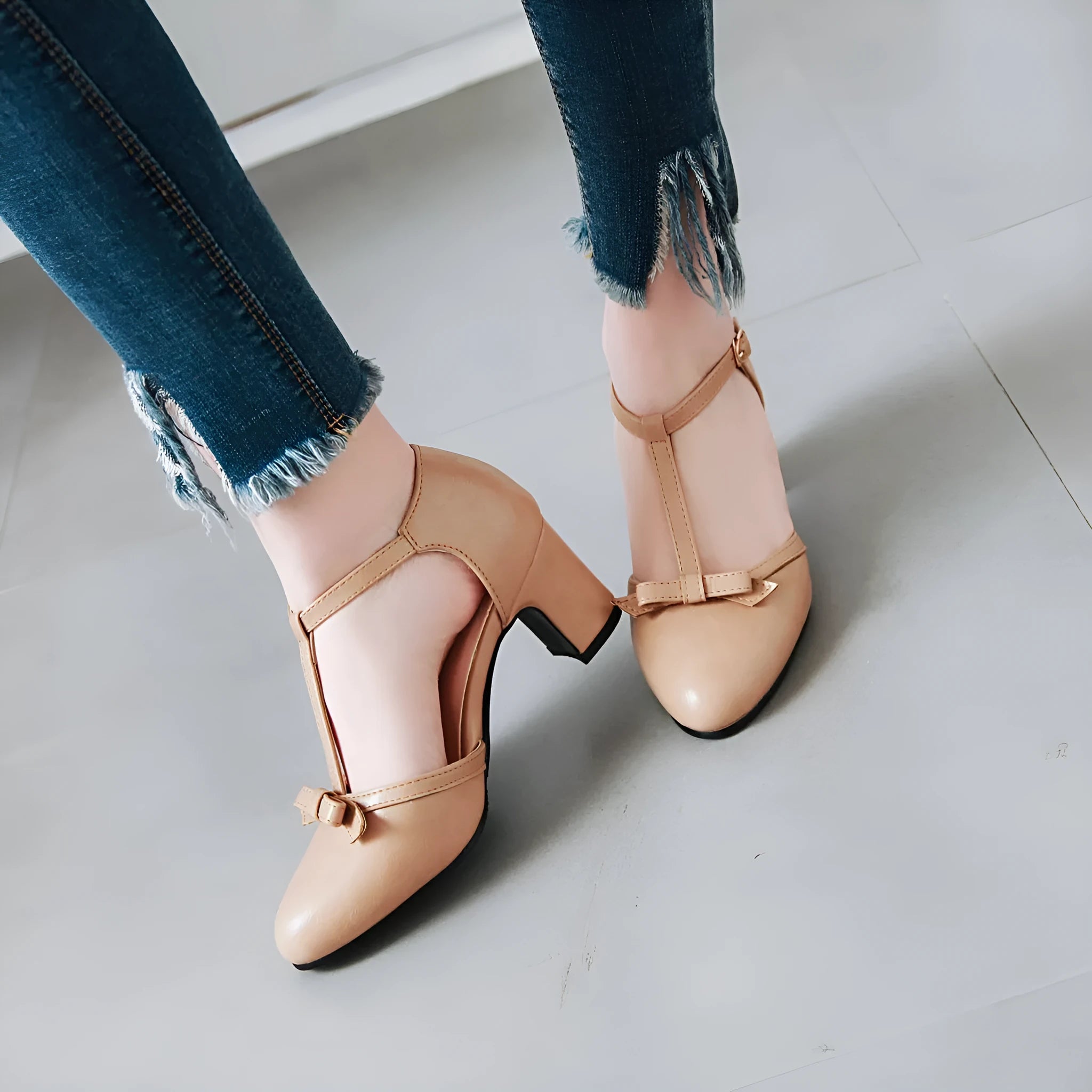Women's chunky heel sandals with bow tie detail and adjustable buckle strap