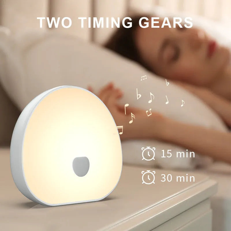 White rechargeable baby night feeding comforter with music function on nursery table