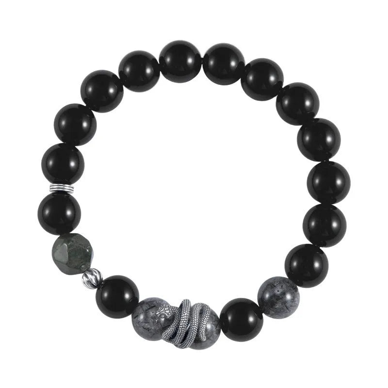 S925 sterling silver snake bracelet with obsidian black hair crystal centrepiece on wrist