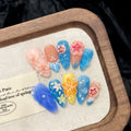 Plastic wearable armour set with three-dimensional carved jellyfish design in almond nail colour