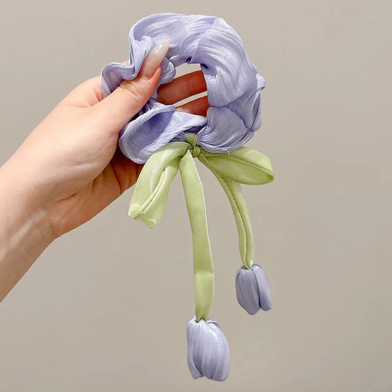 Children's knitted fabric headband with tulip element in Korean style, shown in beige, pink or purple colour option