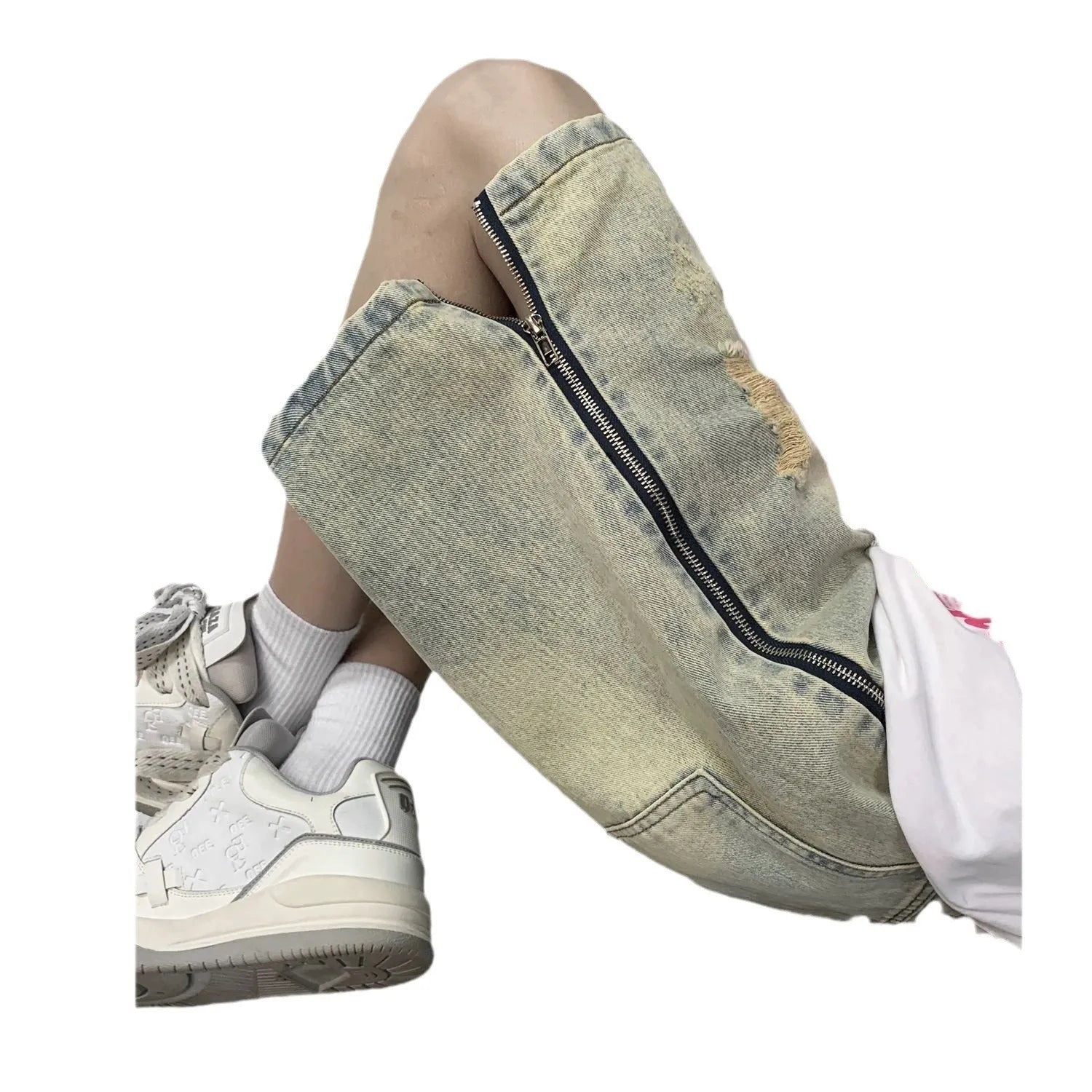 Blue men's loose fit denim shorts with distressed rip details and a yellow mud wash finish.