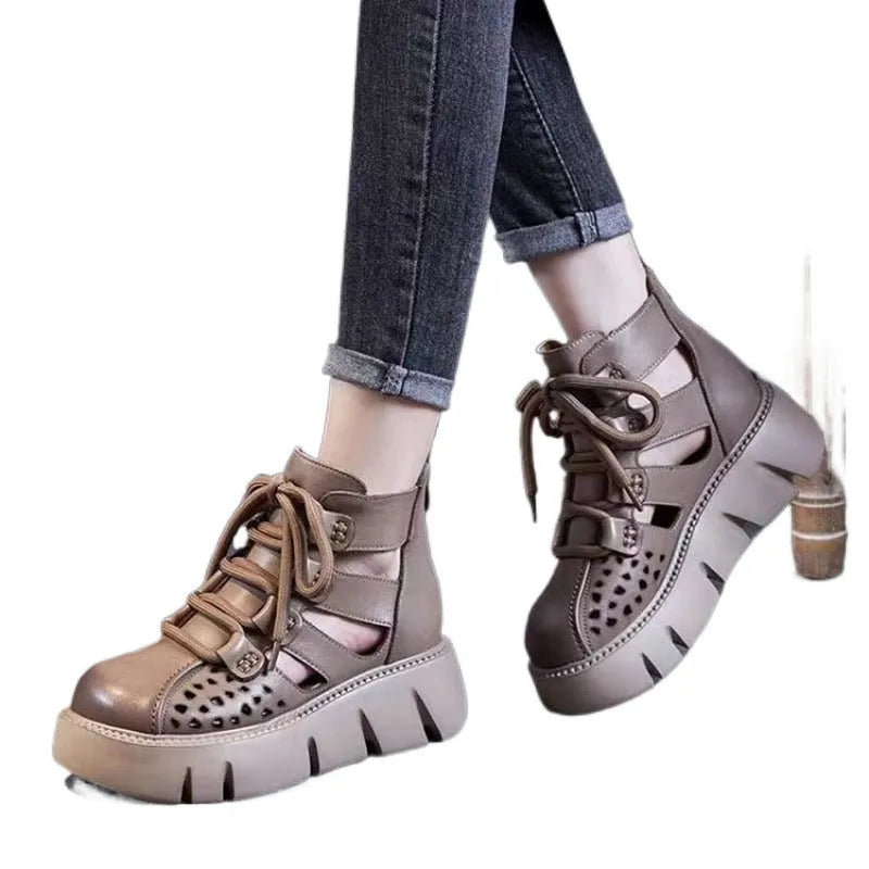 Women's black platform sandals with a hollow-hole leather upper and fish-mouth toe.