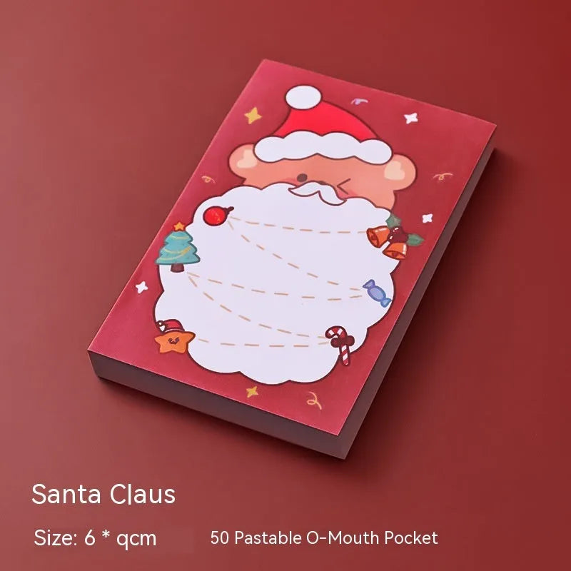 Christmas cartoon sticky notes pad with festive designs including Santa Claus and snowman