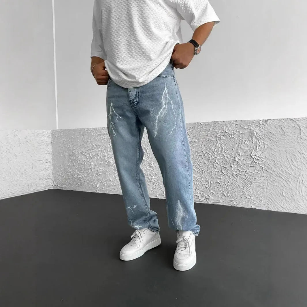 Men's blue straight-leg cotton denim jeans with loose fit and mid-waist design