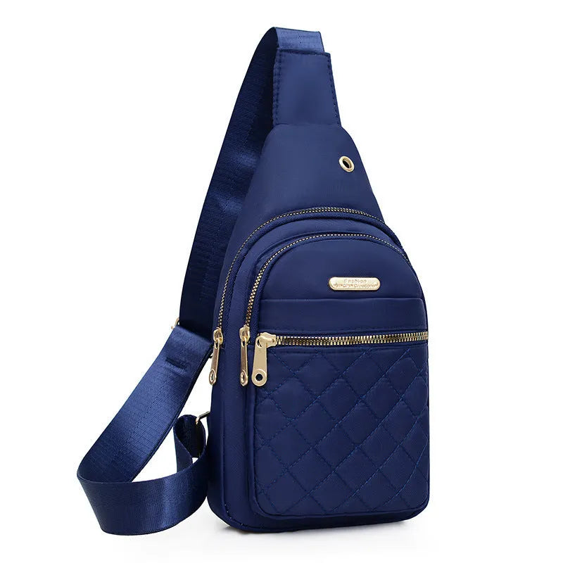 Girls' crossbody sports chest bag in Oxford cloth with plaid design, shown in a dark blue colour.