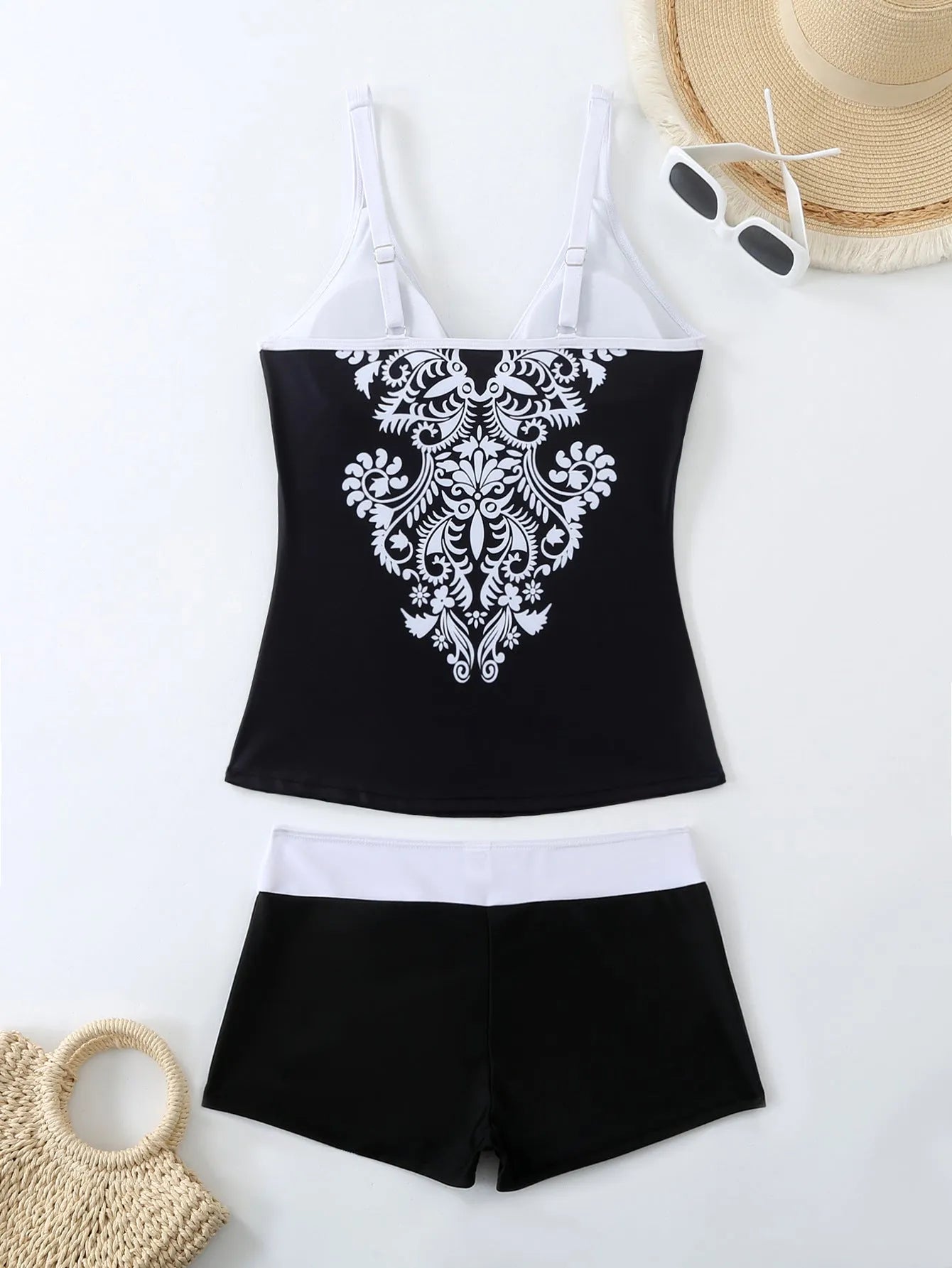 Women's plus size two-piece swimsuit in black or rose red, with briefs bottom.