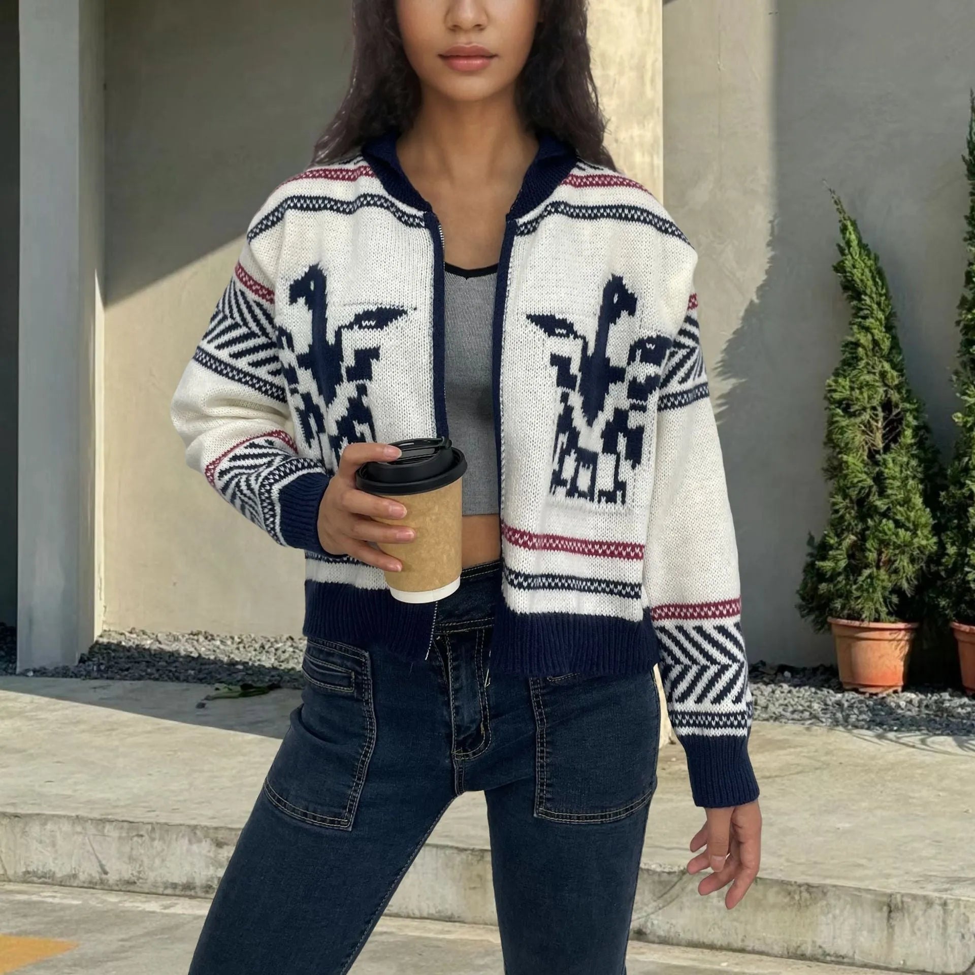 White women's zip-front cardigan sweater with a contrasting jacquard lapel and stripe pattern.