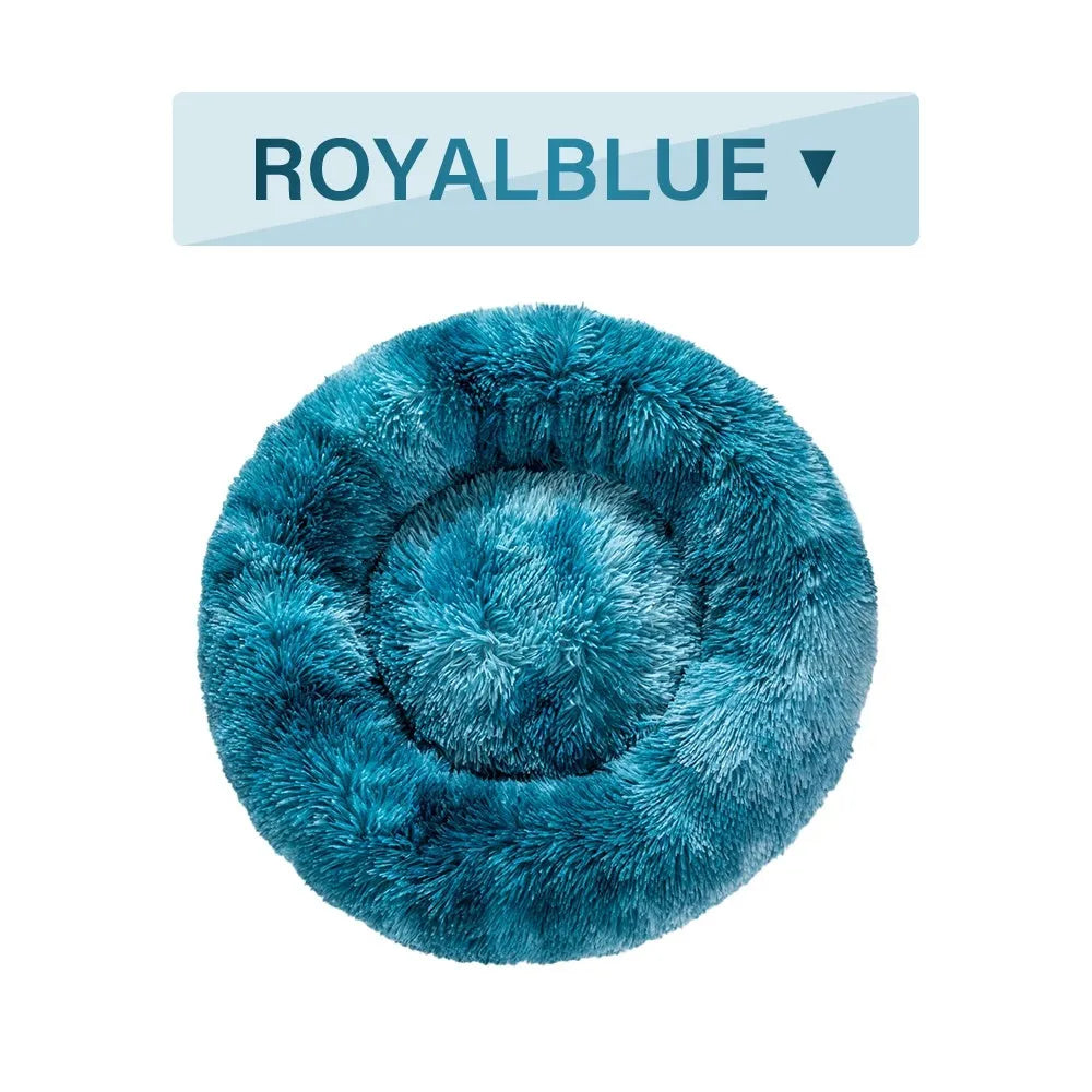 Fluffy donut-shaped pet bed in long plush fabric, shown in a grey colour