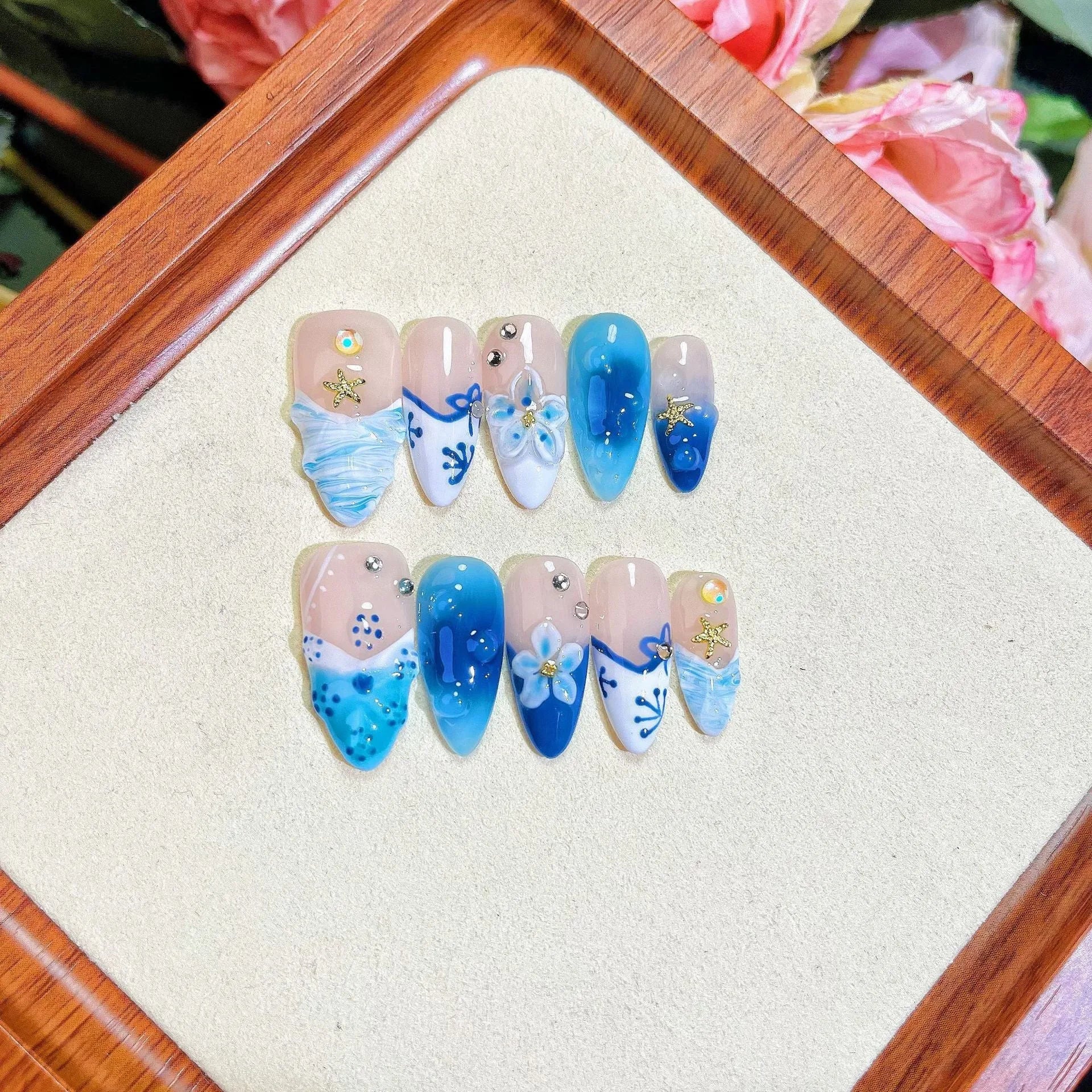 Blue hand-painted carved summer ice transparent plastic fake nails with dimensional design