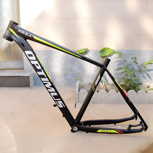 Black green aluminium mountain bike frame for 29-inch wheels with internal cable routing and disc brake mounts.
