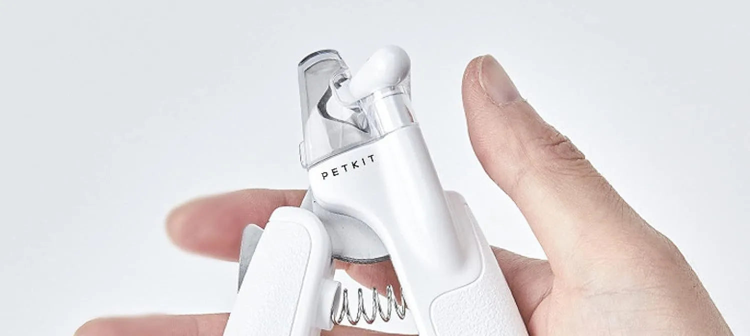 White LED pet nail clipper with transparent anti-splash guard and nail file.