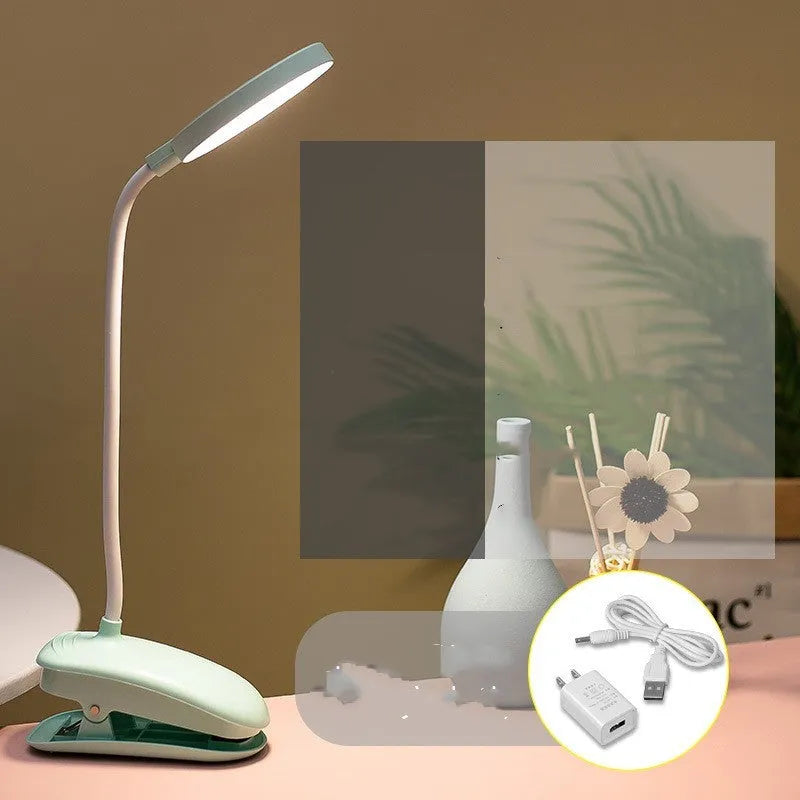 LED clip-on desk lamp with touch dimming, plastic shade, available in white, pink, or green.