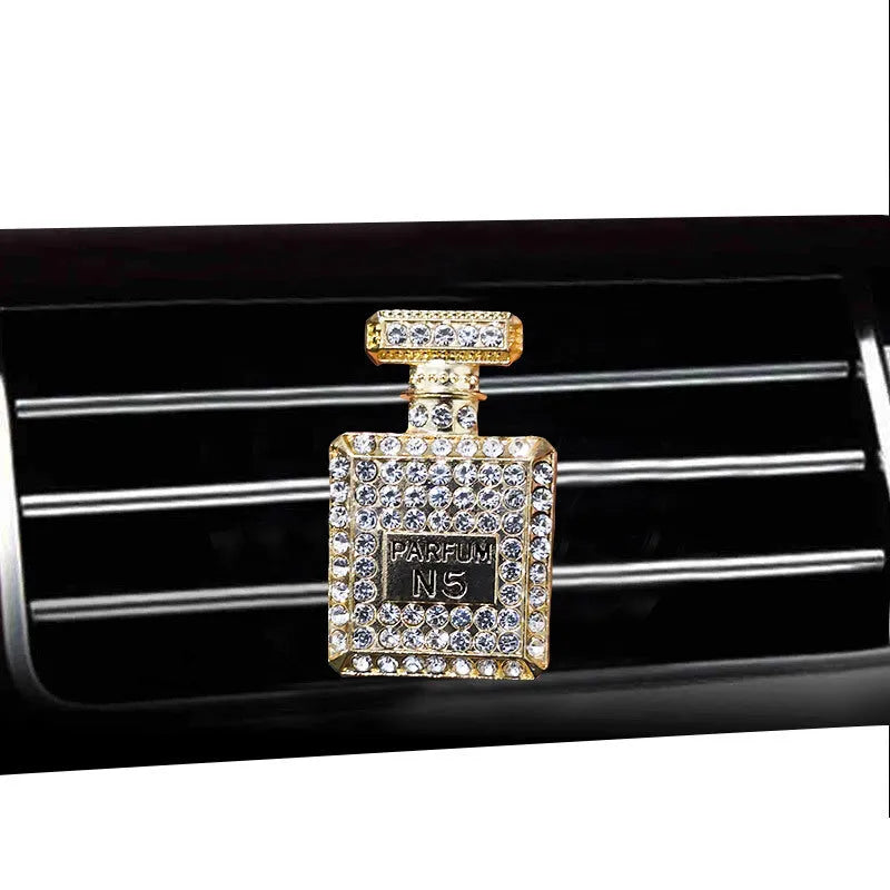 Gold alloy car air freshener holder in perfume bottle style, approx. 4.7cm x 3cm, for fragrance tablets