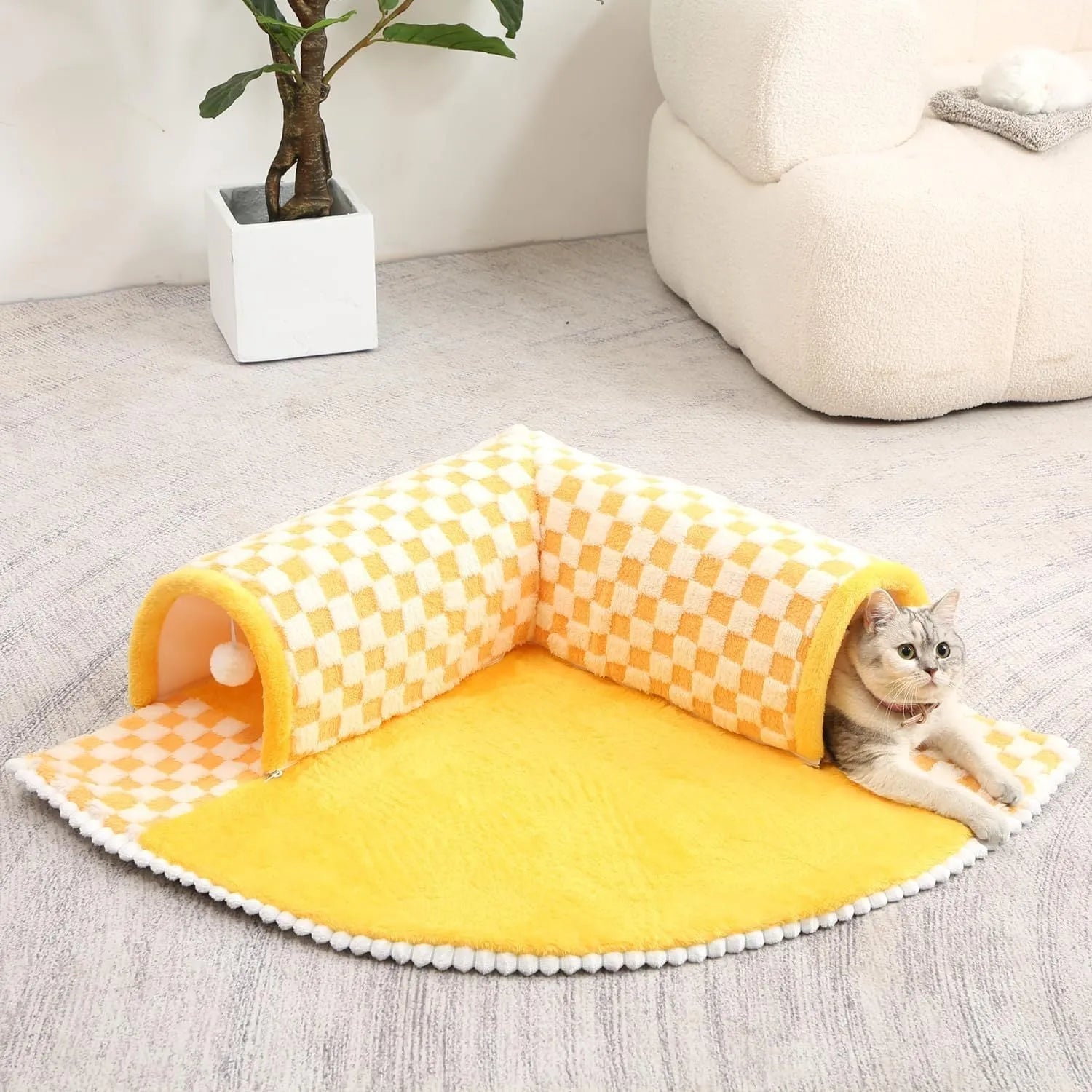 Fan-shaped plush pet bed with integrated tunnel in yellow, showing soft fabric and anti-slip base.
