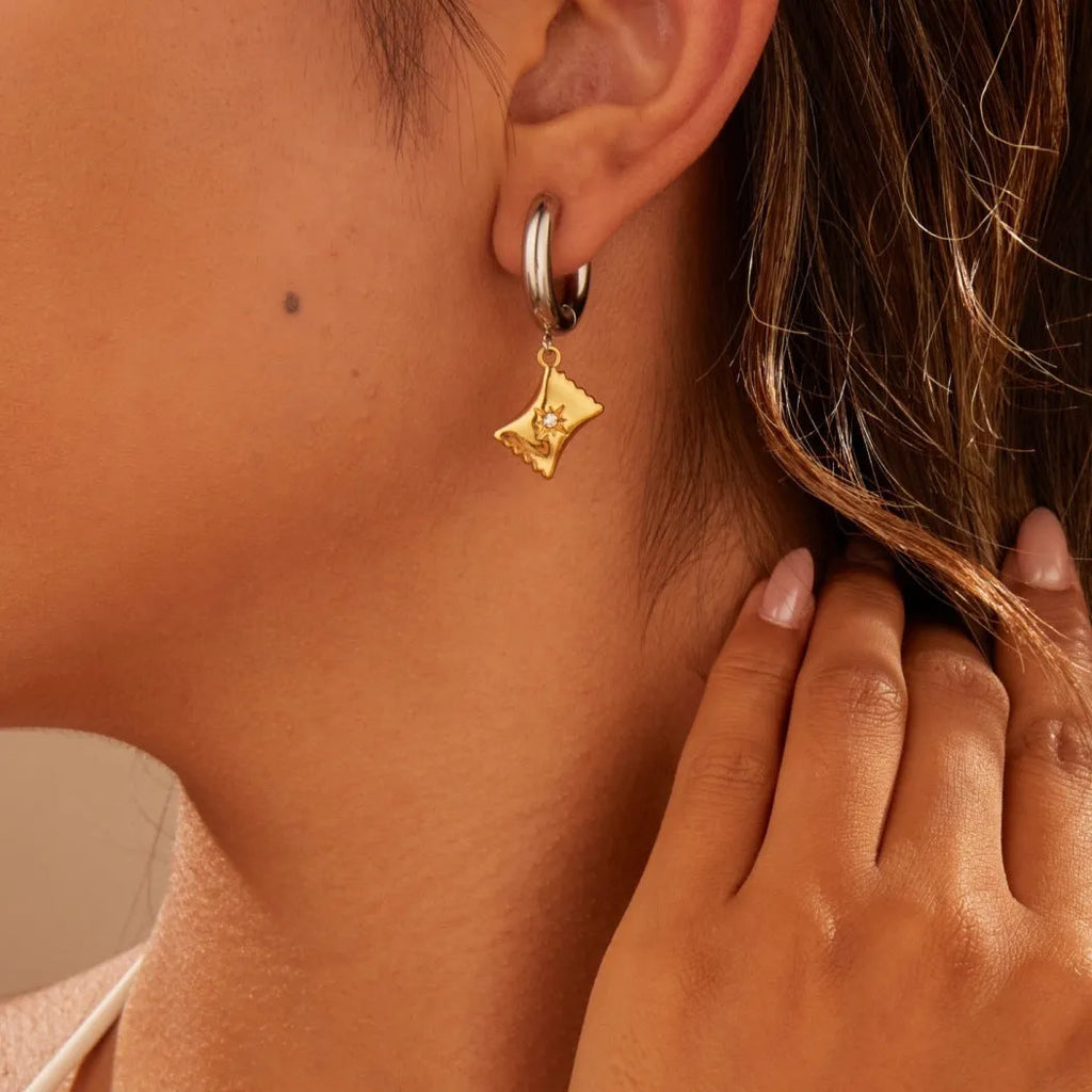 Christmas tree shaped heart earrings with star motifs in gold electroplated stainless steel
