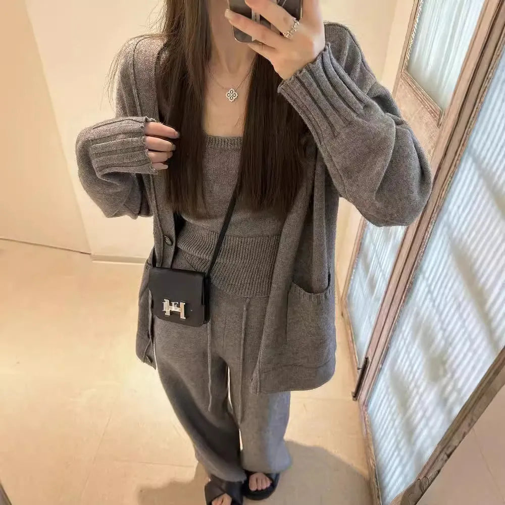 Women's loose-fit knit cardigan, vest, and trousers three-piece set in wool blend fabric.
