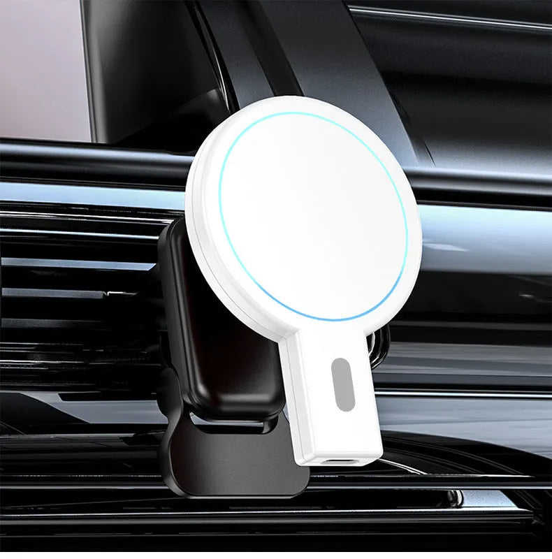 White and black magnetic wireless charger on a desk with a mobile phone