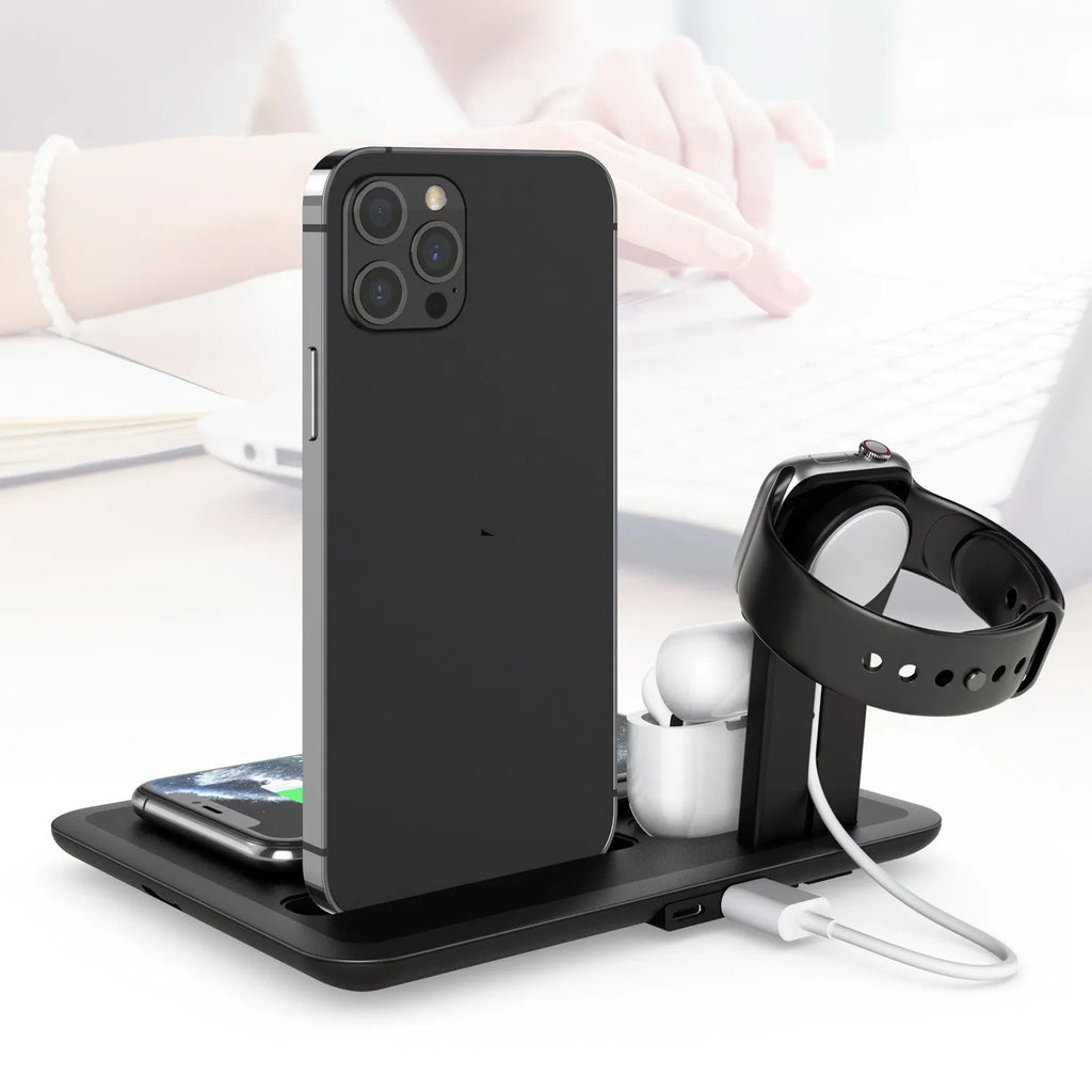 Black desktop wireless charging dock holding an iPhone, Apple Watch and AirPods case with cables connected.