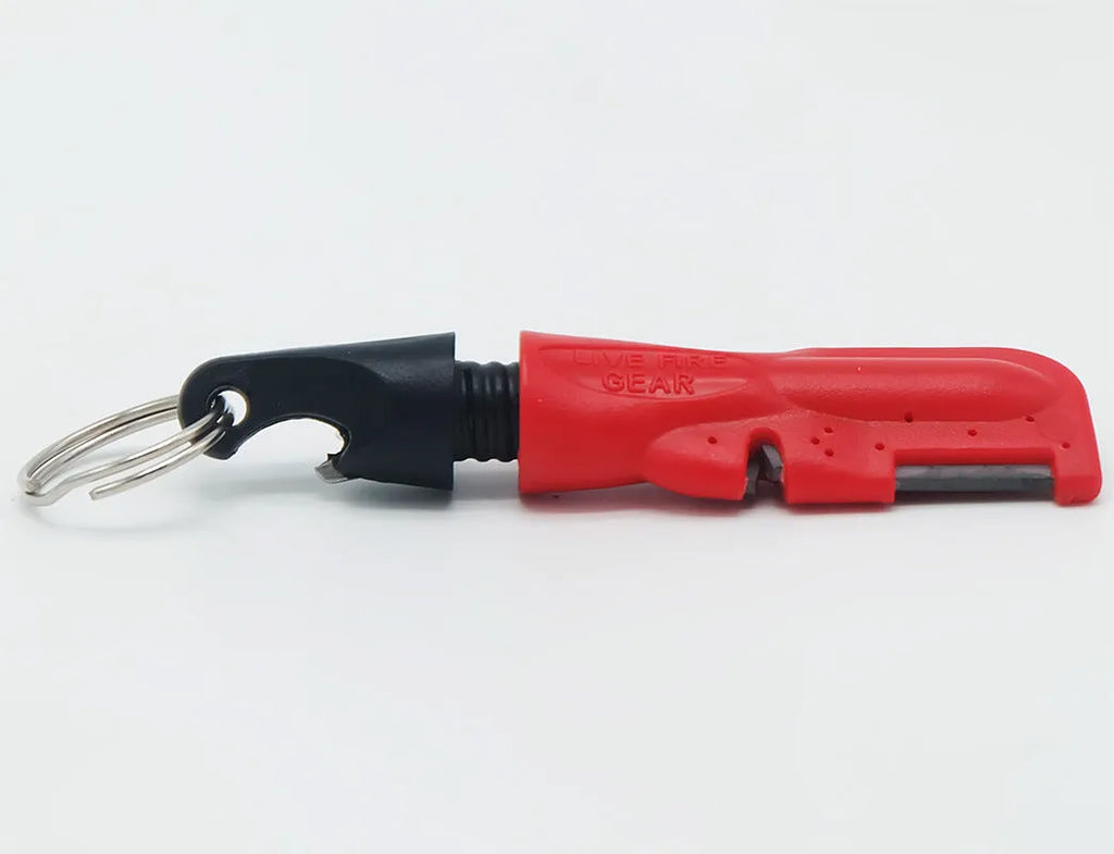Black three-in-one fire starter bottle opener with tungsten carbide scraper and magnesium bar