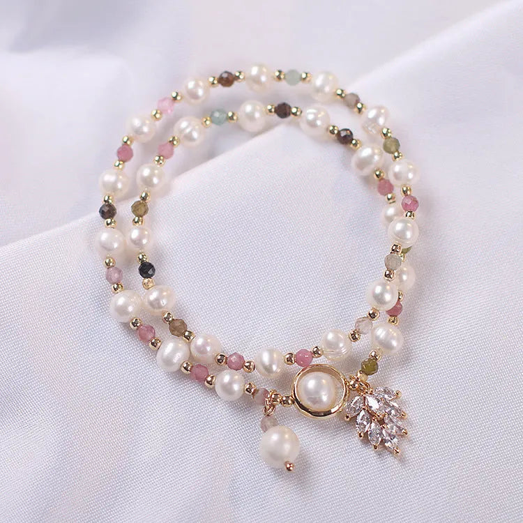 Women's double-layer strawberry quartz crystal bracelet with a Lucky Cat charm in red cat's eye flowers colour.