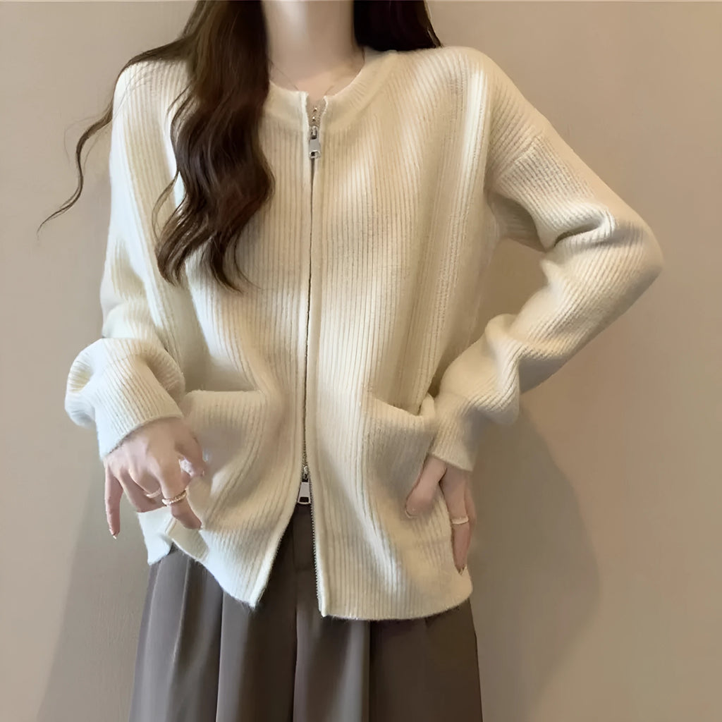 Beige soft viscose women's sweater coat cardigan with long sleeves on a hanger.