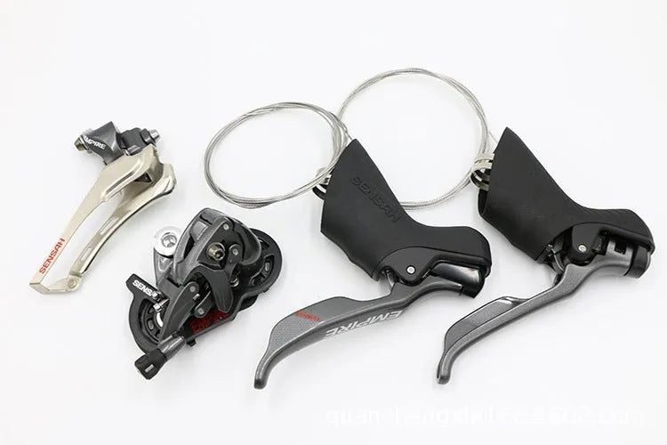 Road bike transmission kit with aluminium manual shift lever, front dial, and short leg rear derailleur.
