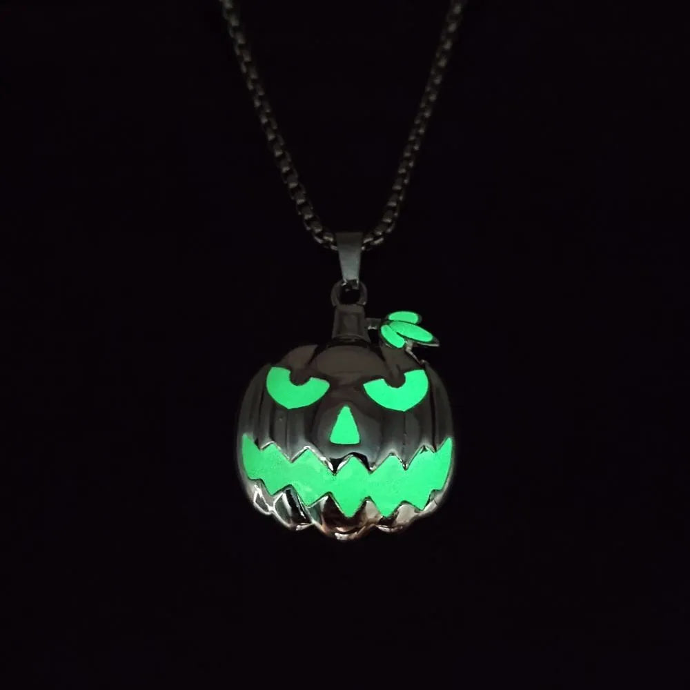 Luminous pumpkin pendant necklace with ghost face design glowing in the dark