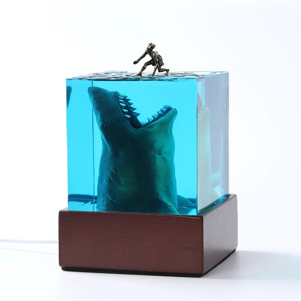 Ocean shark surfer micro landscape night light made of clear epoxy resin on a plastic stand