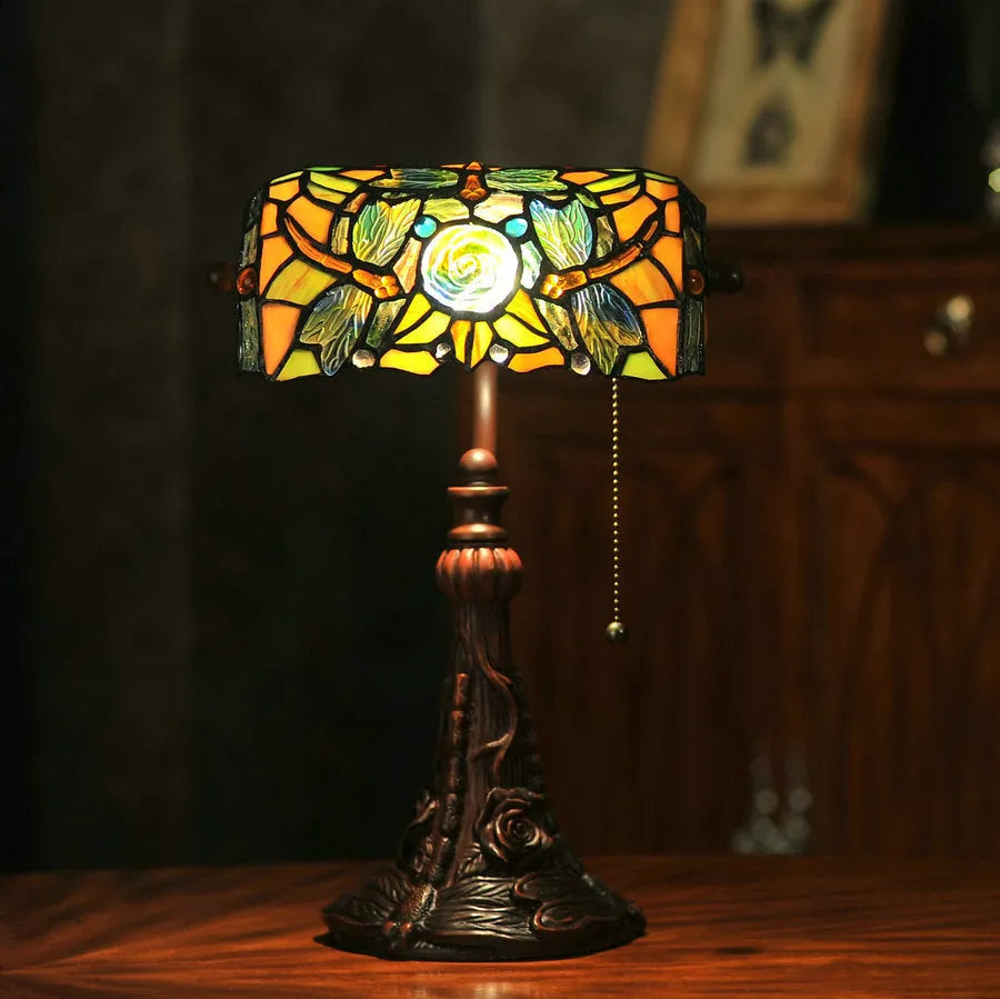 10-inch Tiffany stained glass table lamp with resin base on a desk.