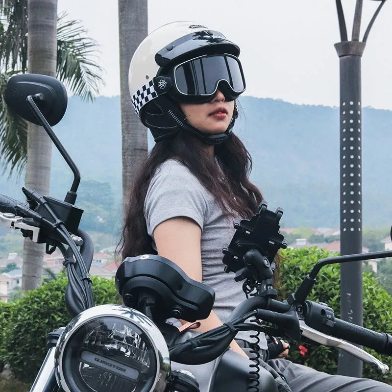 Retro-style motorcycle helmet in cement grey colour on a neutral background.