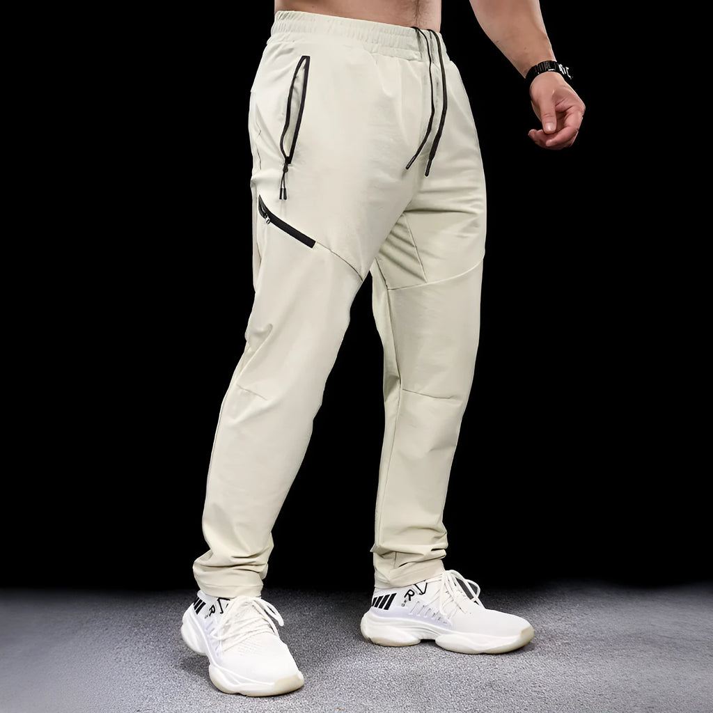 Men's waterproof quick-drying nylon exercise trousers in Army Green colour with mid waist design