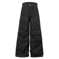 Black pleated jeans with multiple pockets, mid-waist design, and zip placket closure