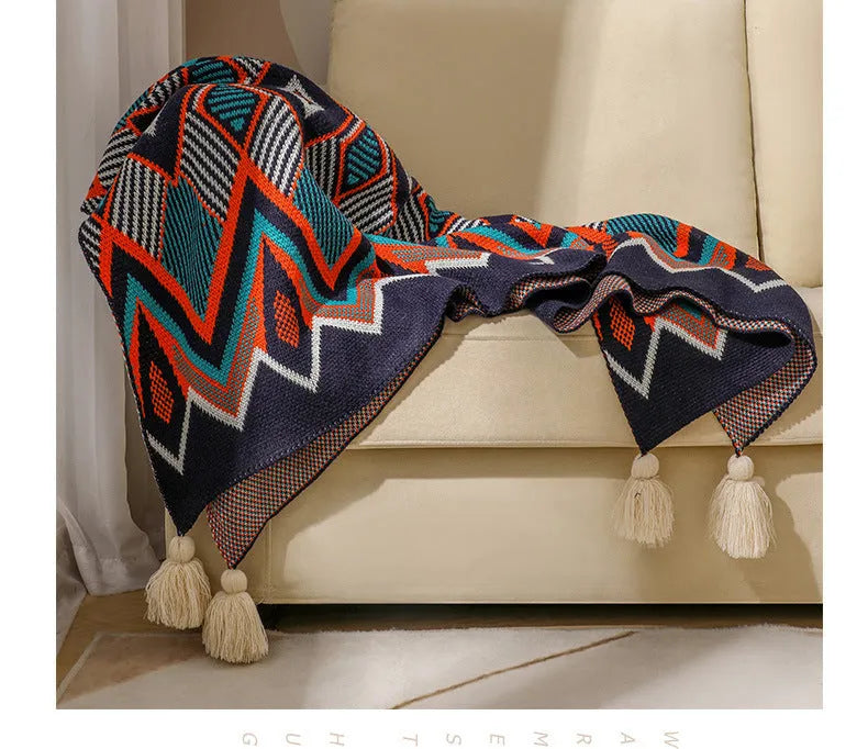 Bohemian-style acrylic sofa cover blanket with tassel trim in a geometric pattern colour option
