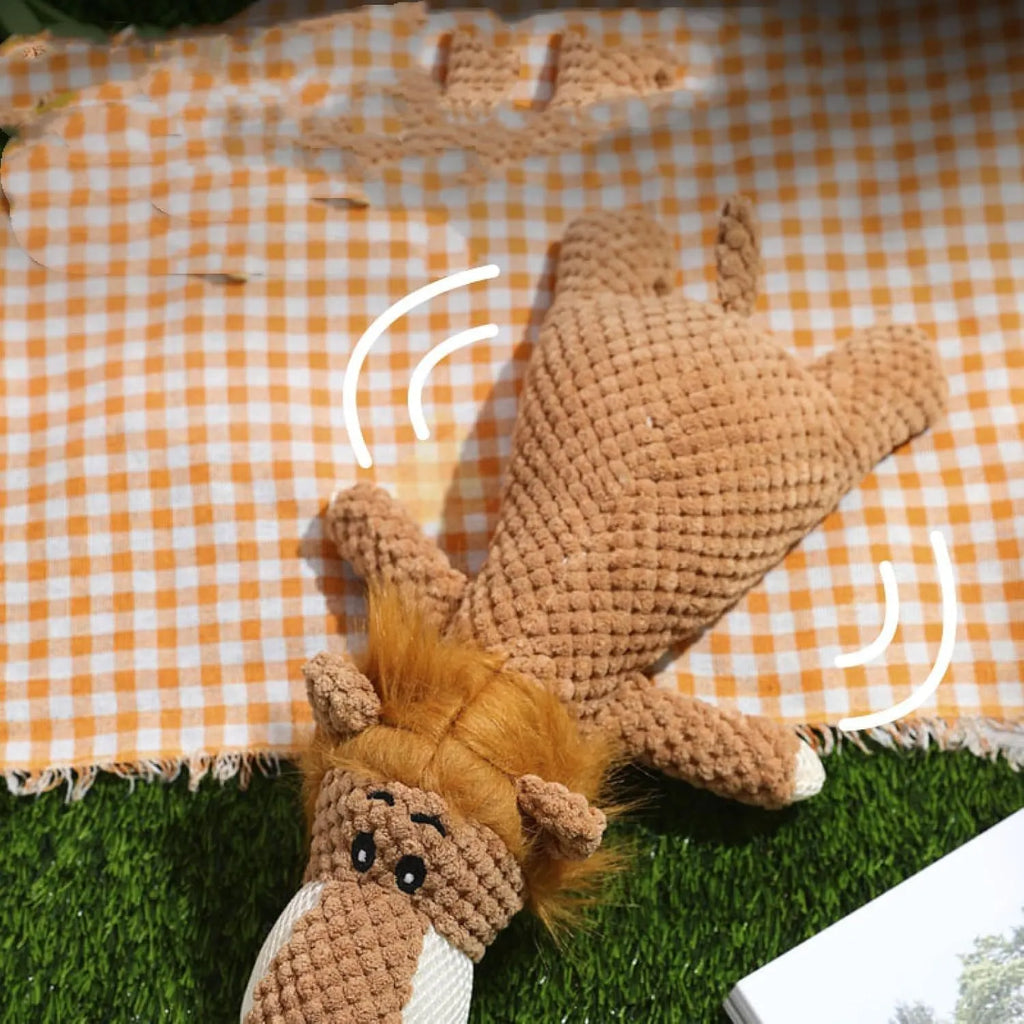 Plush animal-shaped dog toy with a bumpy corn kernel texture, shown in grey, green, and yellow colours.