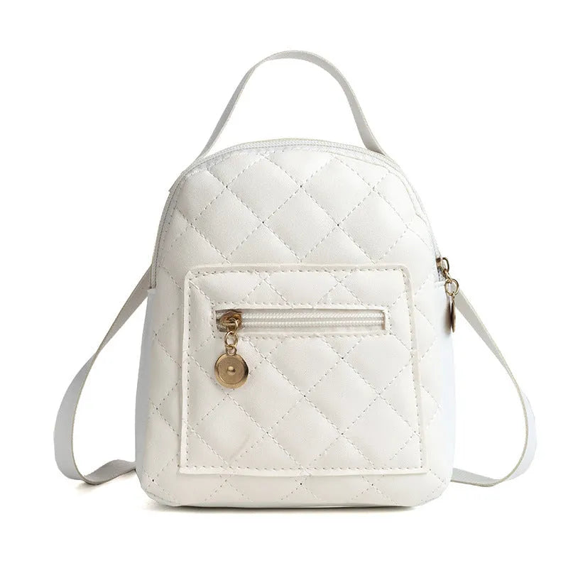 Girls square hard PU backpack with embroidery detail in black, pink or white, showing soft handle and outer pocket.
